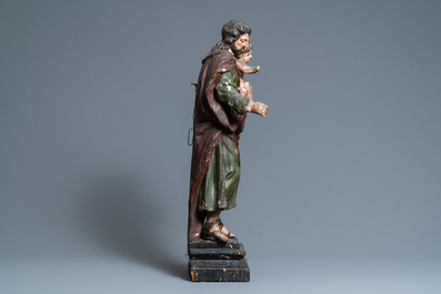 A polychromed wooden figure of Saint Joseph with child, 2nd half 17th C.