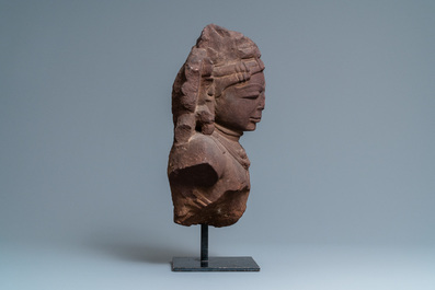 A fine red sandstone bust of a celestial nymph, Central India, 10/11th C.