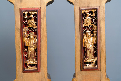 A Chinese gilded wood carving on matching pillars, 19th C.
