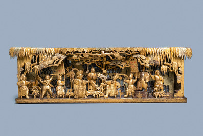 A Chinese gilded wood carving on matching pillars, 19th C.