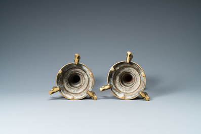 A pair of brass alloy candlesticks on lion feet, The Netherlands, 1st half 15th C.