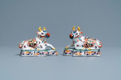 A pair of polychrome Dutch Delft models of cows, 18th C.