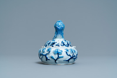 A Dutch Delft blue and white butter tub in the shape of a mermaid, 18th C.