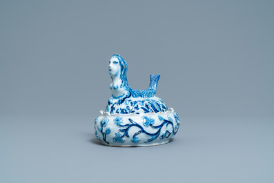 A Dutch Delft blue and white butter tub in the shape of a mermaid, 18th C.