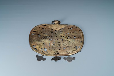 A large Sino-Tibetan reticulated gilt copper plaque with an engraved knot on a ground of lotus flowers, 17th C.