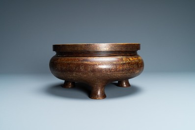 A Chinese parcel-gilt bronze tripod censer, Xuande merk, Qing