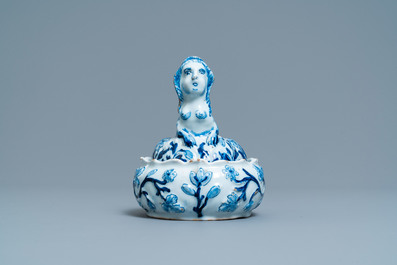 A Dutch Delft blue and white butter tub in the shape of a mermaid, 18th C.