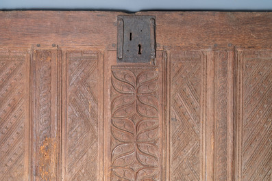 A carved oak front panel of a coffer with tracery panels and geometrical motives, Brittany, France, 17th C.