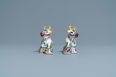 A pair of polychrome Dutch Delft models of cows, 18th C.