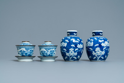 A pair of Chinese blue and white covered bowls on stands and a pair of covered jars, 19th C.