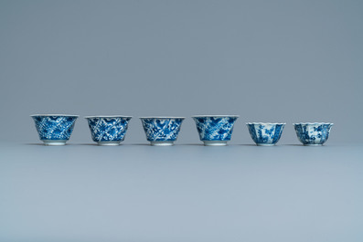Six Chinese blue and white cups and saucers and eleven miniature vases, Kangxi
