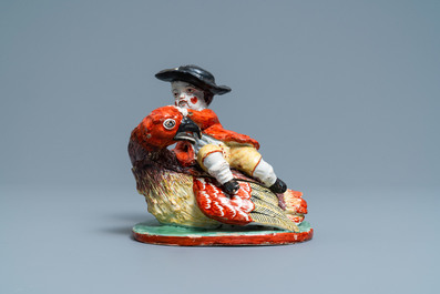Une bo&icirc;te couverte en forme d'un gar&ccedil;on sur un oiseau en fa&iuml;ence de Delft polychrome, 18&egrave;me