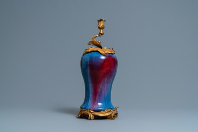 A Chinese flamb&eacute;-glazed vase with gilt bronze candelabra mount, 19th C.