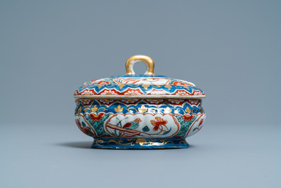 A polychrome and gilded Dutch Delft spice box and cover, early 18th C.