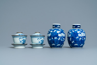 A pair of Chinese blue and white covered bowls on stands and a pair of covered jars, 19th C.