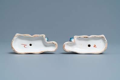 A pair of polychrome Dutch Delft models of cows, 18th C.