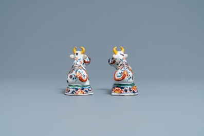 A pair of polychrome Dutch Delft models of cows, 18th C.