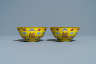 A pair of Chinese famille rose yellow-ground 'butterfly' bowls, Tongzhi mark, 20th C.
