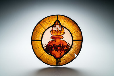 A painted glass 'Sacred Heart of Jesus' medallion, France, 17th C.