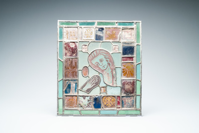 A composite stained and painted glass window mounted in lead alloy, France, 13th C. and later