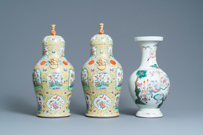 A pair of Chinese Canton famille rose yellow-ground vases and a 'warrior' vase, Qianlong mark, 19th C.