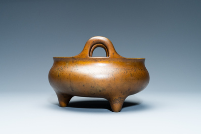 A Chinese bronze tripod censer, Xuande mark, 18th C.