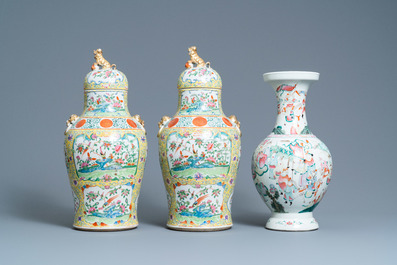 A pair of Chinese Canton famille rose yellow-ground vases and a 'warrior' vase, Qianlong mark, 19th C.
