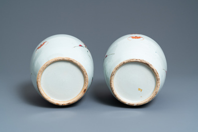 A pair of Chinese famille rose jars and covers, 19th C.