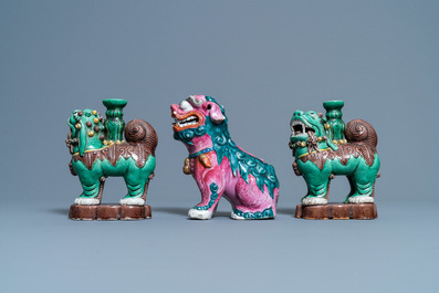 A Chinese famille rose model of a Buddhist lion and a pair of verte biscuit joss stick holders, 19th C.