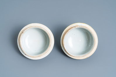 A pair of Chinese Canton famille rose yellow-ground vases and a 'warrior' vase, Qianlong mark, 19th C.