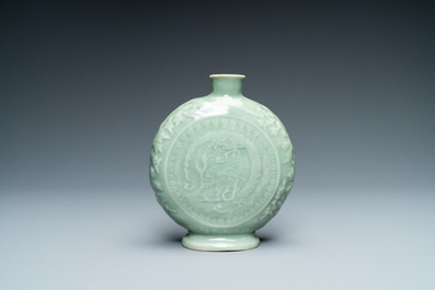 Three Chinese monochrome celadon and blanc de Chine vases and two bowls, 19/20th C.