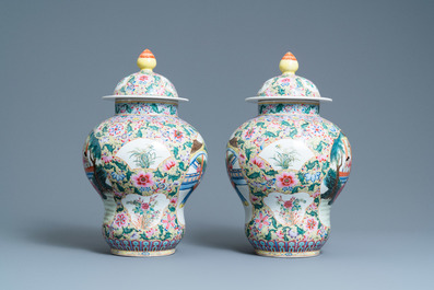 A pair of Chinese famille rose yellow-ground vases and covers, Qianlong mark, Republic