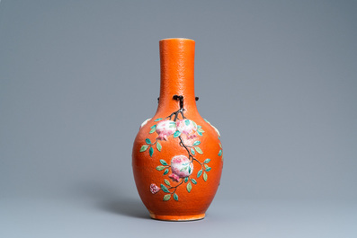 A Chinese famille rose 'sanduo' vase with applied design on a coral red ground, 19th C.