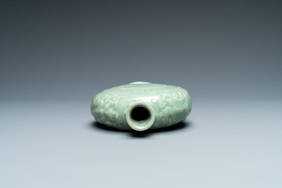 Three Chinese monochrome celadon and blanc de Chine vases and two bowls, 19/20th C.