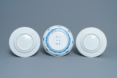 A pair of Chinese famille rose plates, Qianlong, and a blue and white plate, Kangxi mark and of the period