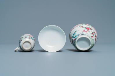 A Chinese famille rose covered bowl, a cup and two saucers with landscape design, Yongzheng