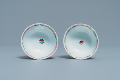 A pair of Chinese famille rose cups and saucers with landscape design, Yongzheng