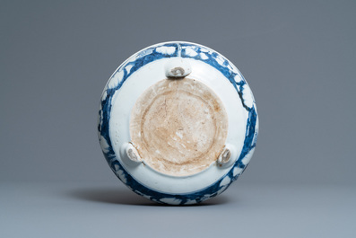 A Chinese blue and white tripod censer with figures in a mountainous landscape, Kangxi