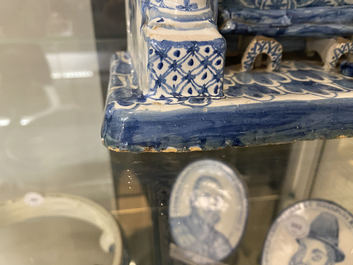 A Dutch Delft blue and white fireplace-shaped box and cover, ca. 1800