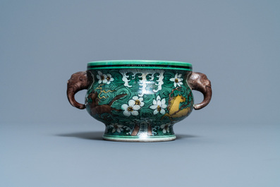 A Chinese verte biscuit 'flaming horses' censer, Jiajing mark, 18/19th C.