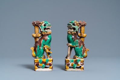 A pair of Chinese sancai models of dogs and a pair of 'Buddhist lions' joss stick holders, Kangxi