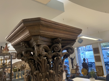 A pair of reticulated carved oak Corinthian columns with cherub heads and vines, 17th C.