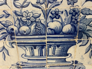 A blue and white Portuguese tile mural depicting an urn filled with flowers and fruits, 18th C.