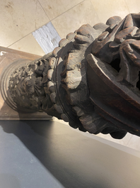 A pair of reticulated carved oak Corinthian columns with cherub heads and vines, 17th C.