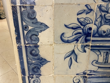 A blue and white Portuguese tile mural depicting an urn filled with flowers and fruits, 18th C.