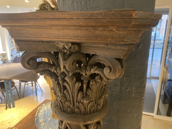 A pair of reticulated carved oak Corinthian columns with cherub heads and vines, 17th C.