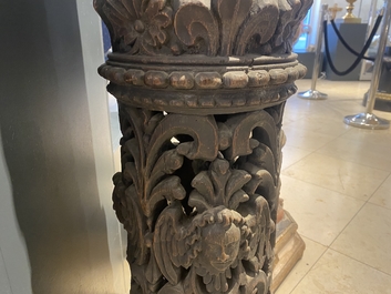 A pair of reticulated carved oak Corinthian columns with cherub heads and vines, 17th C.