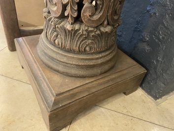 A pair of reticulated carved oak Corinthian columns with cherub heads and vines, 17th C.