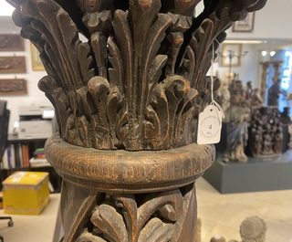 A pair of reticulated carved oak Corinthian columns with cherub heads and vines, 17th C.