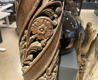 A pair of reticulated carved oak Corinthian columns with cherub heads and vines, 17th C.